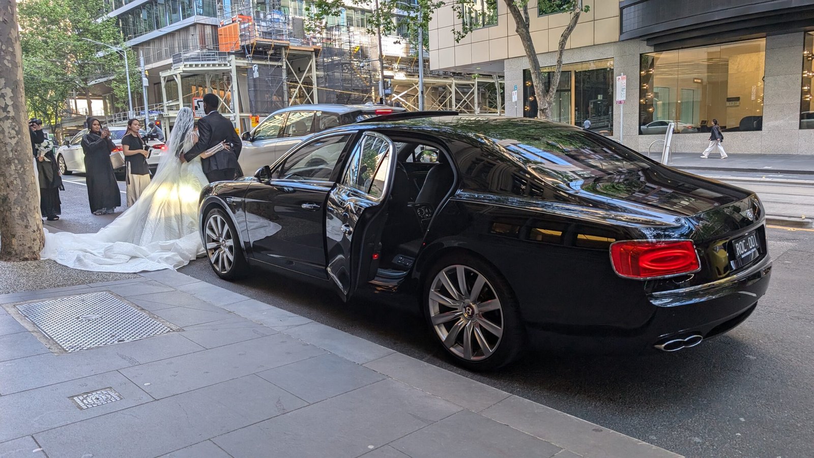 A black Bentley Flying Spur is featured