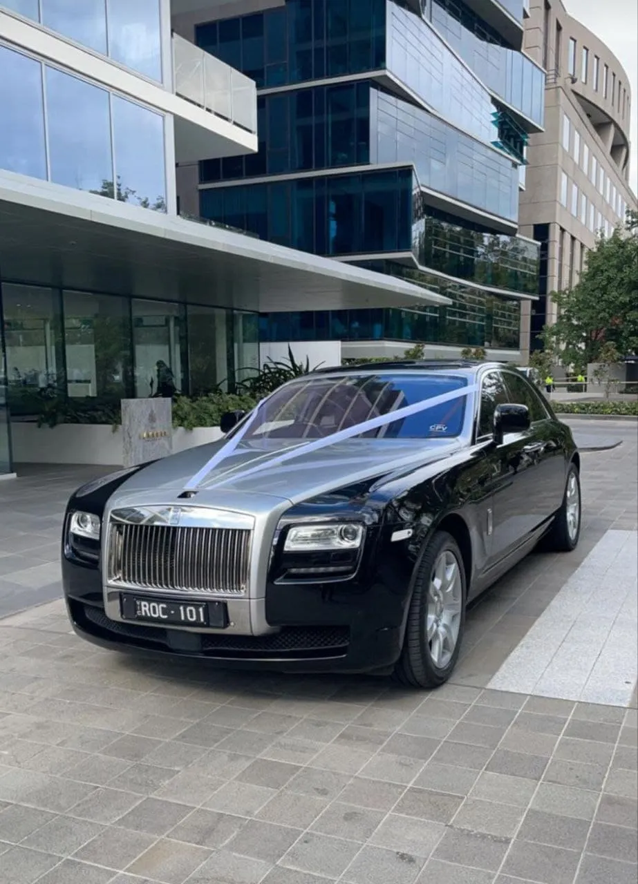 Rolls-Royce Ghost with ribbon.