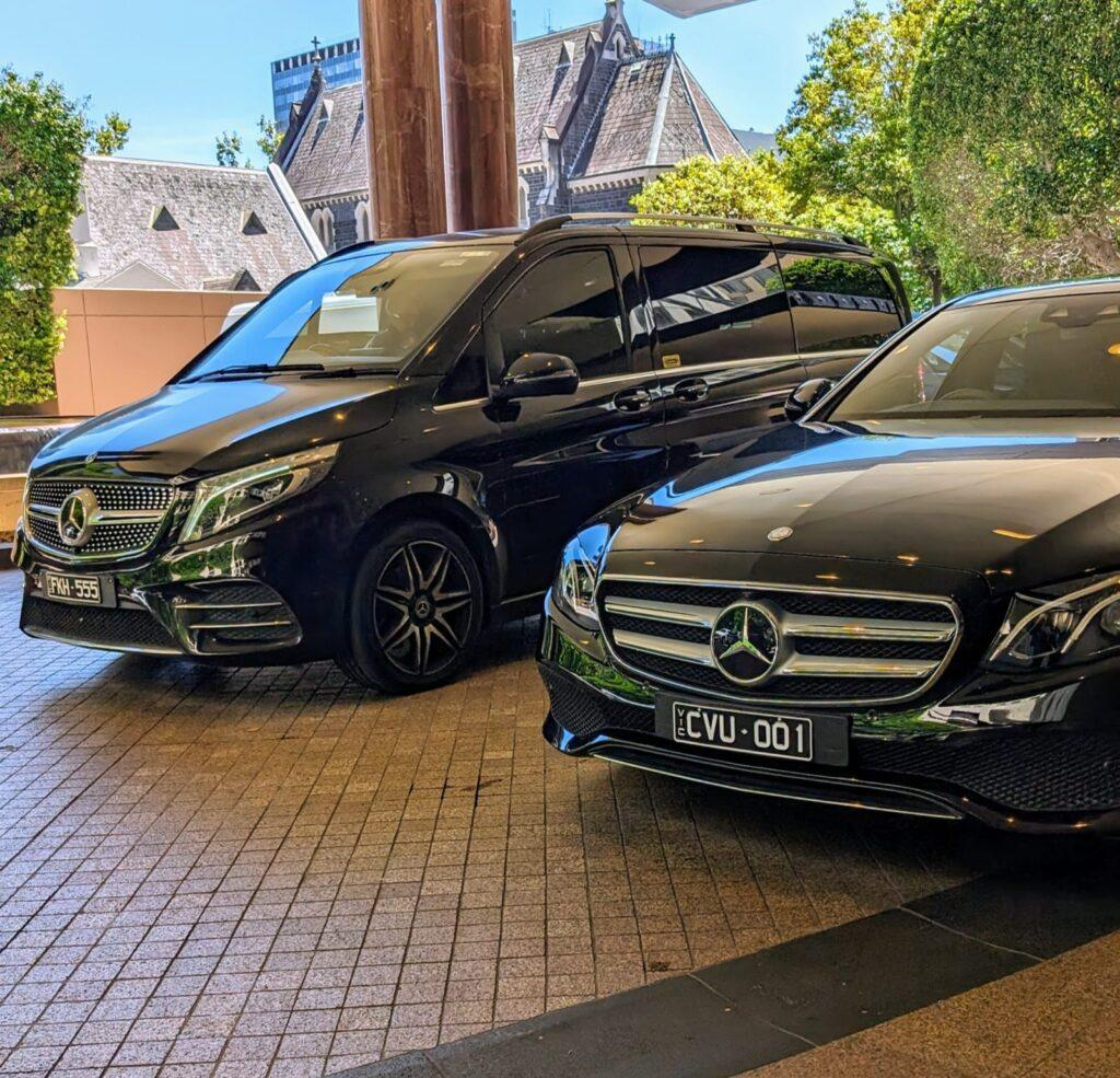 Black Mercedes-Benz V-Class van and sedan.