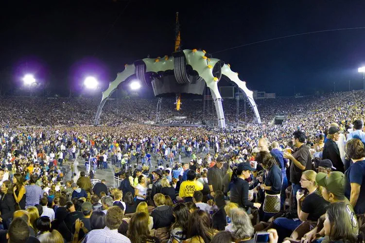 A large crowd attends an outdoor concert.