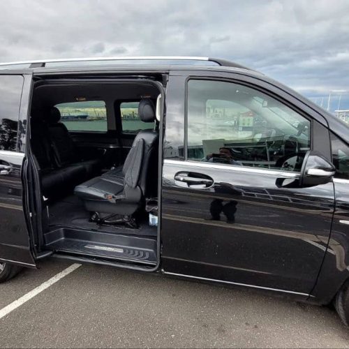 Dark gray Mercedes V-Class van open door.